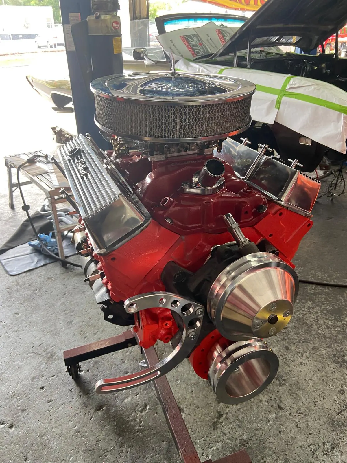 Rebuilt small-block Chevy V8 with Edelbrock valve covers and chrome air cleaner